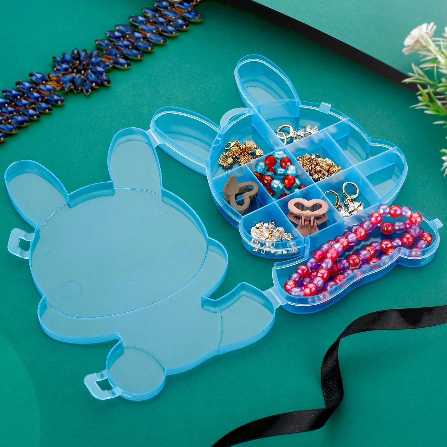 Clear storage box for small objects with bear design. Clear storage box for small objects with bear design.